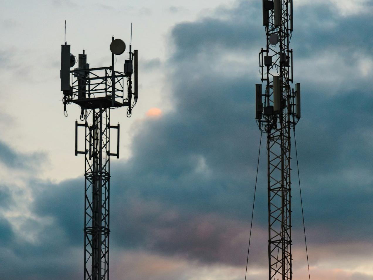 a couple of cell towers sitting next to each other